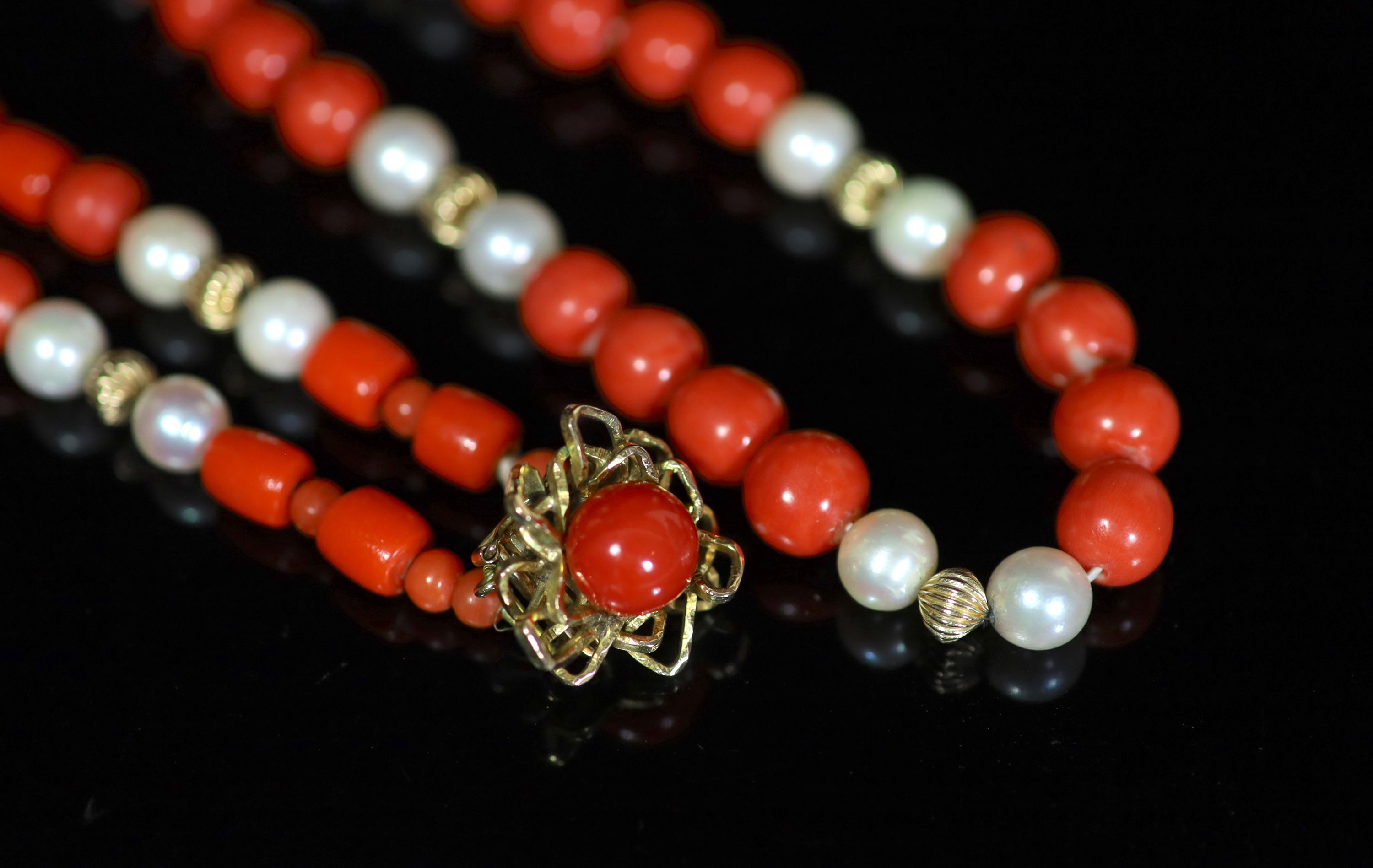 A coral bead and cultured pearl necklace with 14K yellow gold clasp,